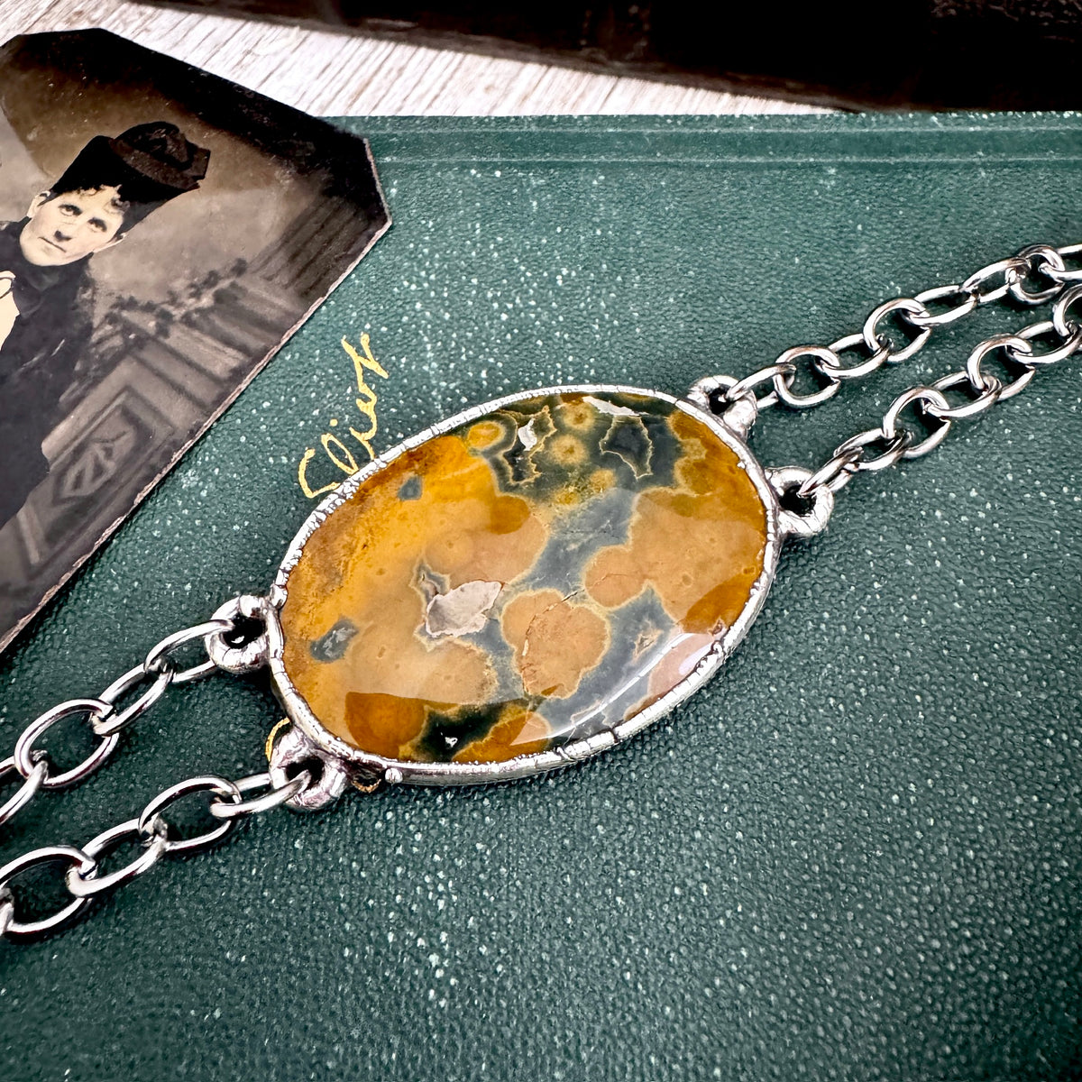 One-of-a-kind ocean jasper crystal bracelet by Foxlark Crystal Jewelry with fine silver accents, showcasing colorful polished stones.