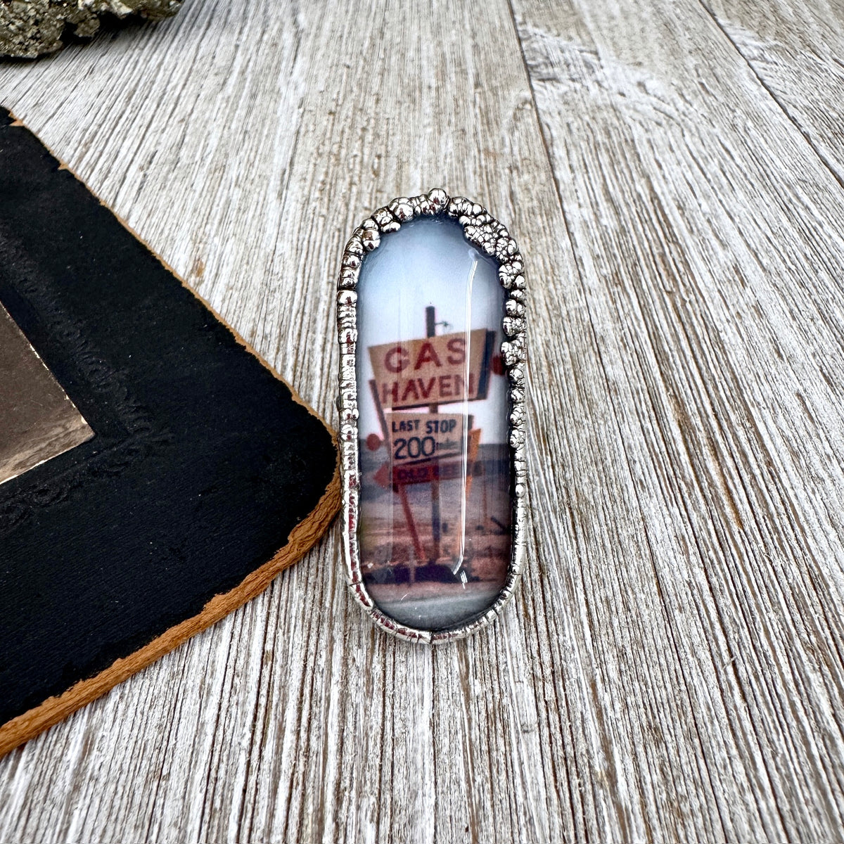 Silver ring featuring a detailed "Road To Nowhere" gas station road sign design, size 6.5, by FOXLARK.