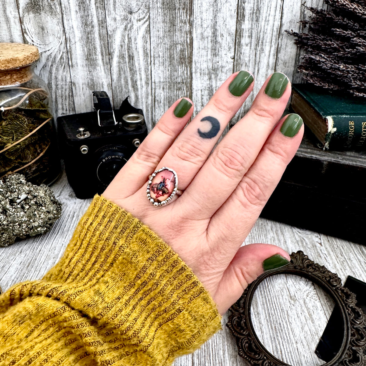 One of a kind FOXLARK silver ring featuring a cowboy road sign design, size 8, with detailed craftsmanship.