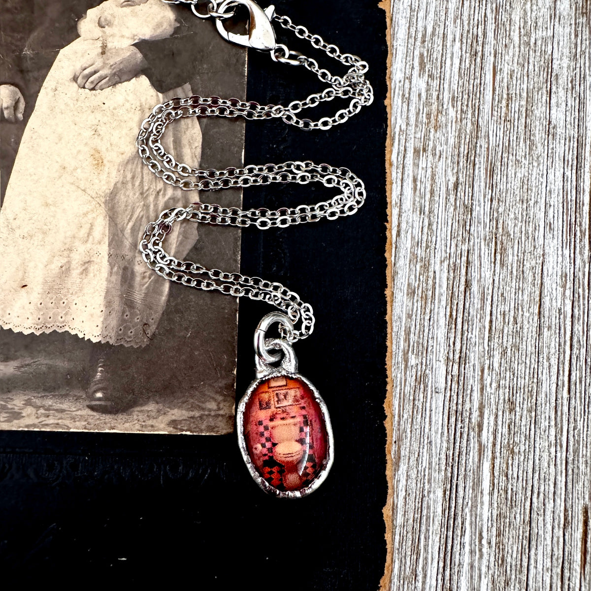 Vintage silver necklace featuring a dive bar bathroom toilet charm from FOXLARK's Road To Nowhere collection.