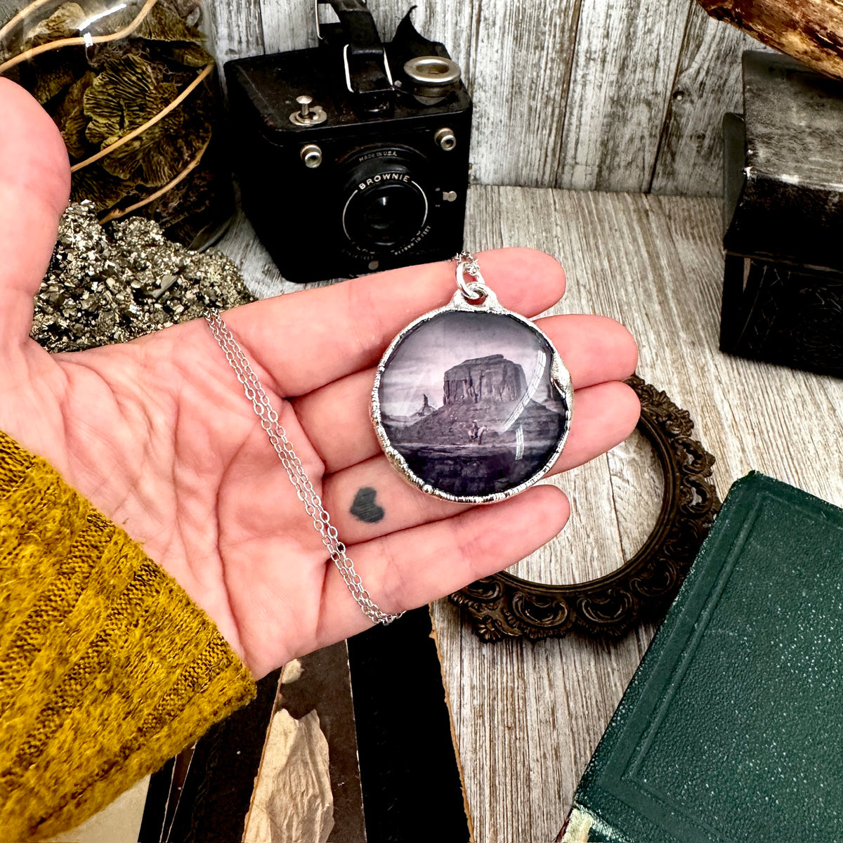 Fine silver cowboy on horse desert necklace by FOXLARK, featuring a detailed one-of-a-kind "Road To Nowhere" design.