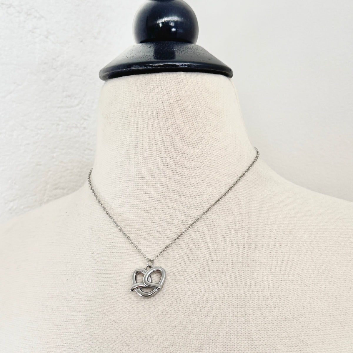 FoXLARK pretzel charm necklace featuring a quirky "Carbs Are a Personality" pendant, perfect for charm jewelry collection.