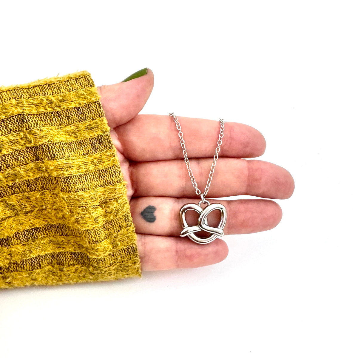FOXLARK Pretzel Charm necklace featuring a quirky "Carbs Are a Personality" pendant, perfect for charm jewelry enthusiasts.