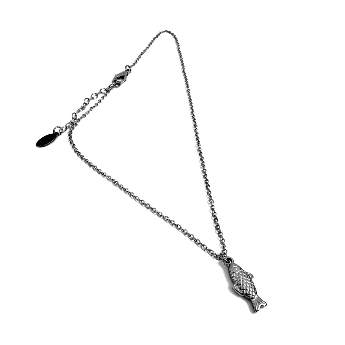 FOXLARK fish charm pendant from the Plenty More Fish in the Sea collection, dainty charm or necklace accessory on a silver chain.