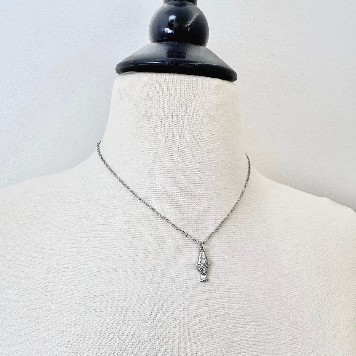 FOXLARK Fish Charm pendant necklace from the Plenty More Fish in the Sea collection, dainty charm with detailed fish design.