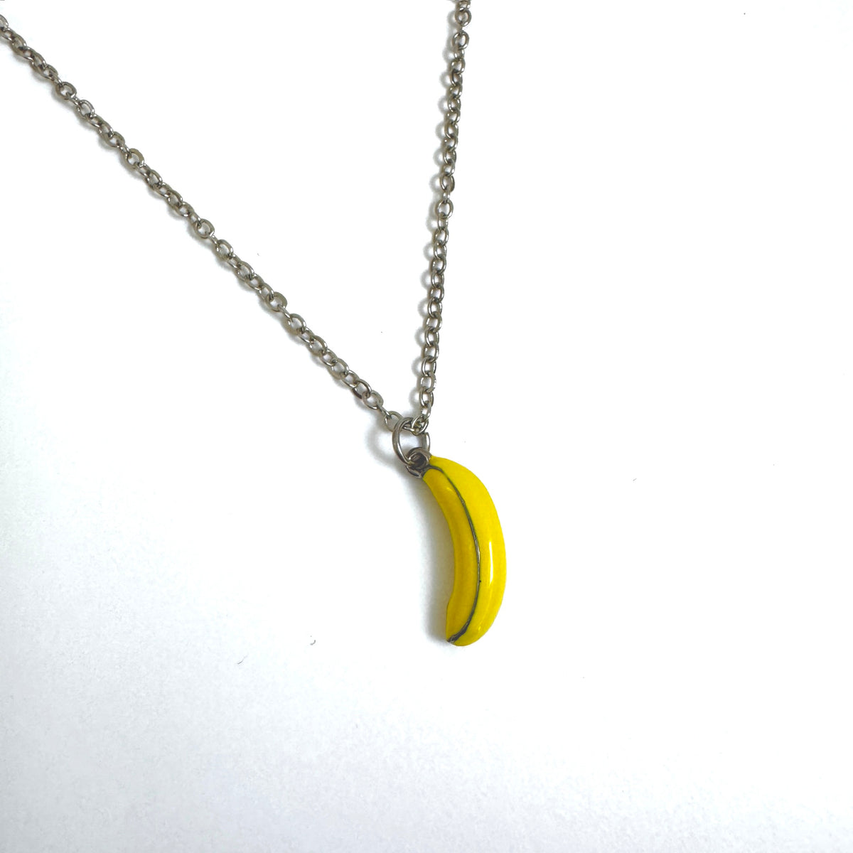 FOXLARK Banana Charm pendant necklace with quirky design, featuring a playful banana shape and colorful details.