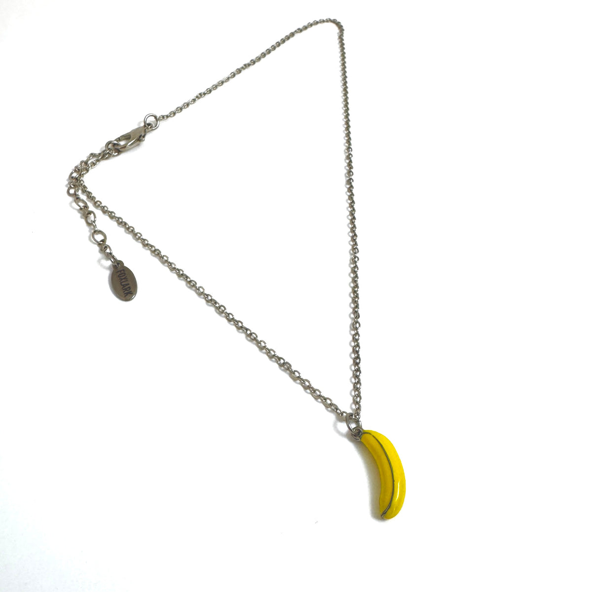 FOXLARK banana charm pendant necklace with quirky, playful design, featuring a yellow banana charm on a silver chain.