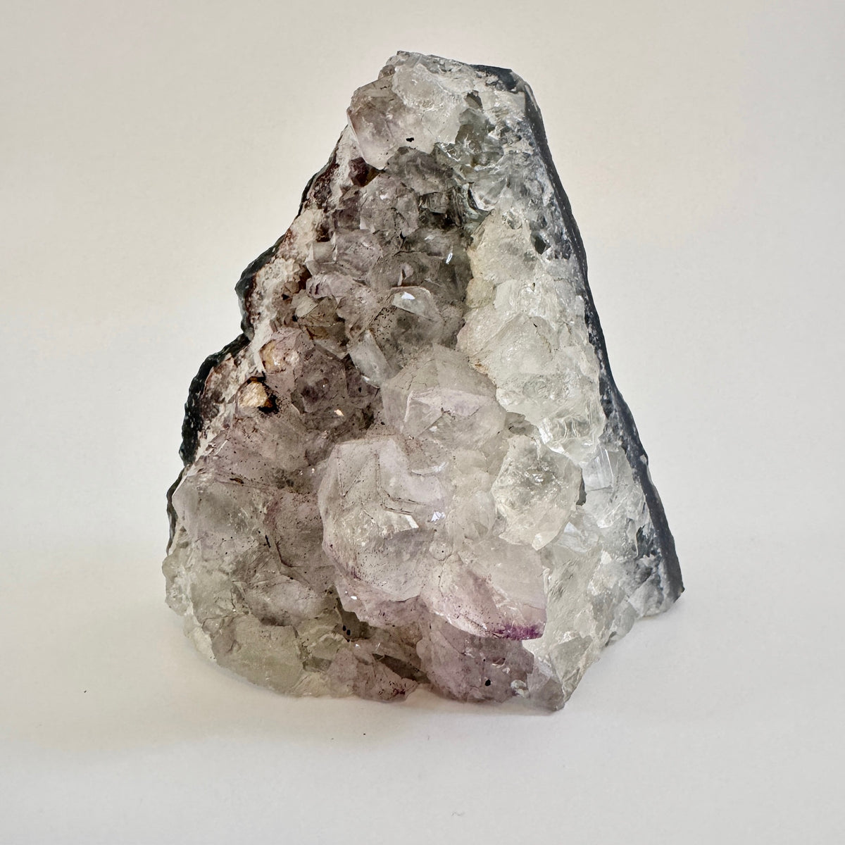 Self-standing amethyst geode crystal cluster from FOXLARK showcasing vibrant purple crystals and natural rock formation.