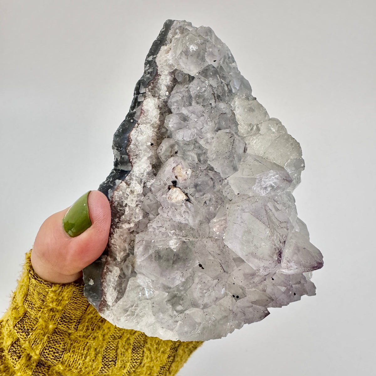 Self-standing amethyst geode crystal cluster from FoxlarkCrystals, showcasing purple crystalline formations and natural rock base.