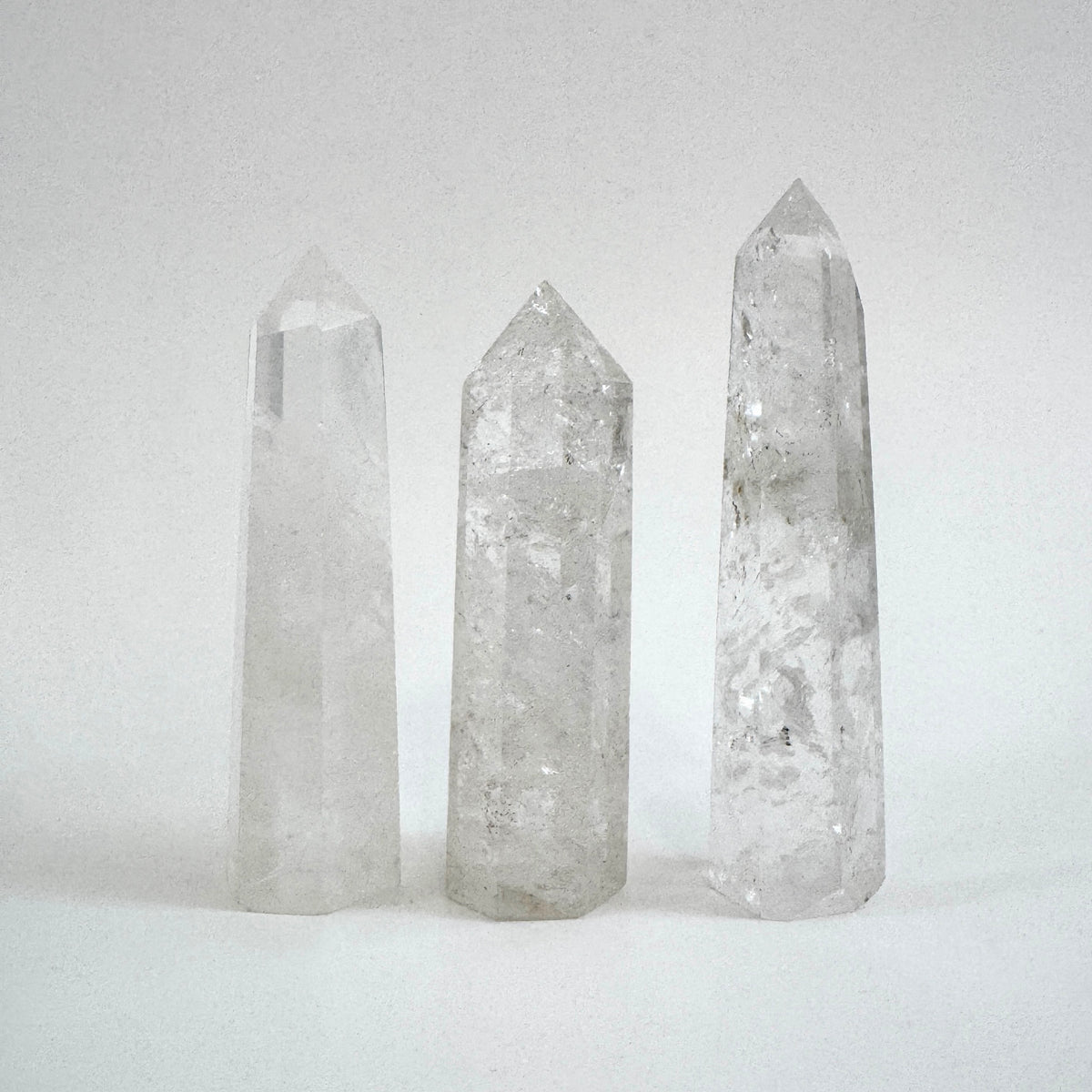 Self-standing clear quartz crystal point from FoxlarkCrystals, showcasing its transparent, natural crystal formation.