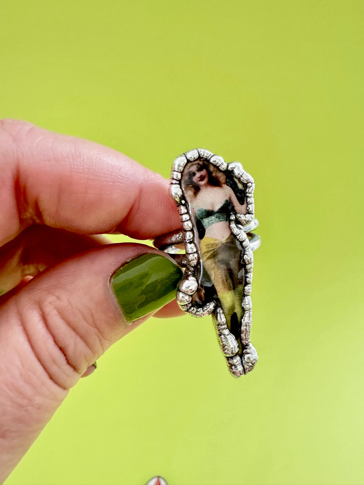 Retro pin-up girl statement ring in fine silver size 9 by FOXLARK, featuring a detailed pin-up girl design on the ring.