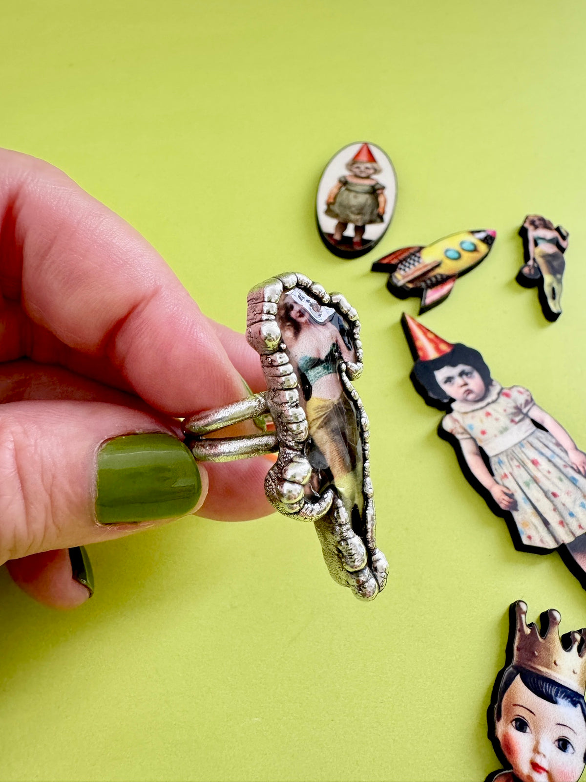 Retro pin-up girl statement ring in fine silver by FOXLARK, size 9, featuring detailed vintage-inspired design.