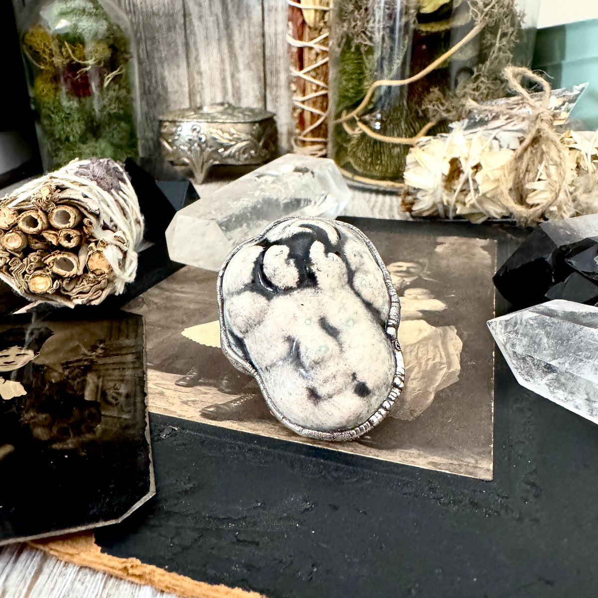 Fine silver ceramic baby doll head ring by FOXLARK, size 7.5, from the Foxlark Collection, featuring detailed doll head design.