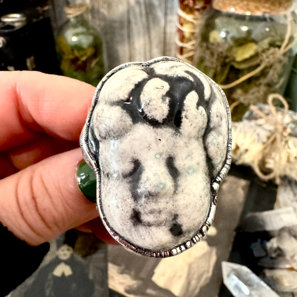 Fine silver ceramic baby doll head ring by FOXLARK, size 7.5, from the Foxlark Collection, featuring detailed doll face design.