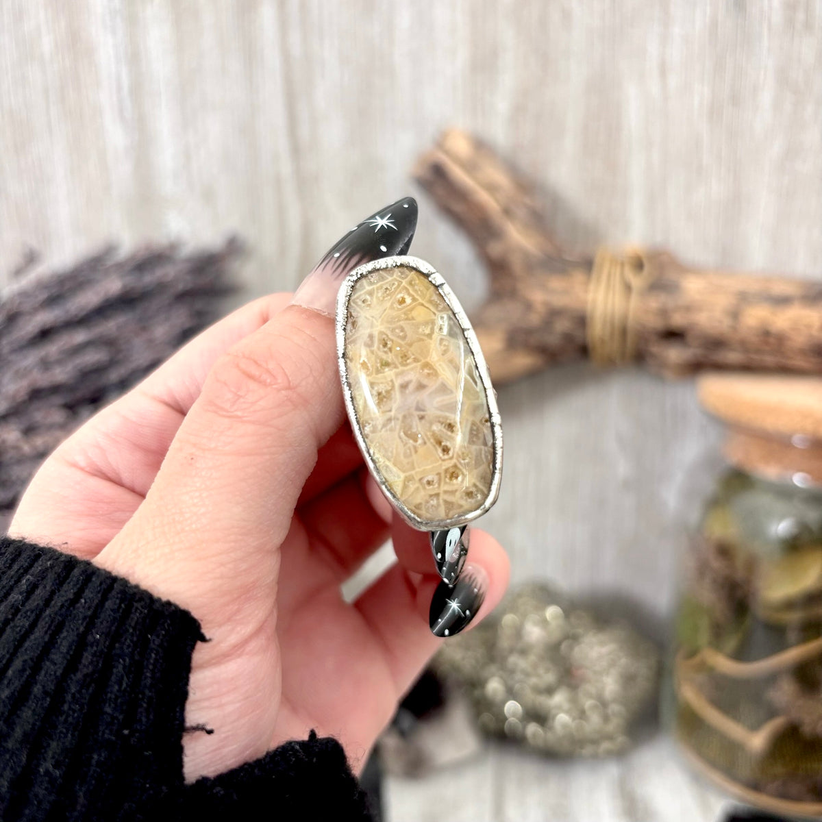 Fossilized coral crystal ring by FOXLARK, fine silver band, size 7.5, showcasing a unique coral crystal on a stylish ring.