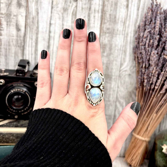FOXLARK rainbow moonstone crystal ring in sterling silver, adjustable size 6-9, featuring a colorful, polished gemstone setting.