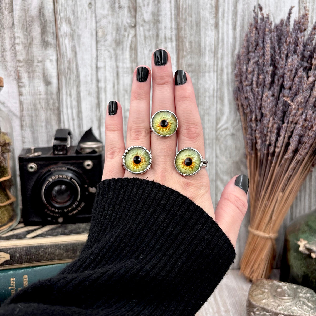 Close-up of a green eyeball design silver ring from FOXLARK collection, available in sizes 5 to 10, detailed and stylish.