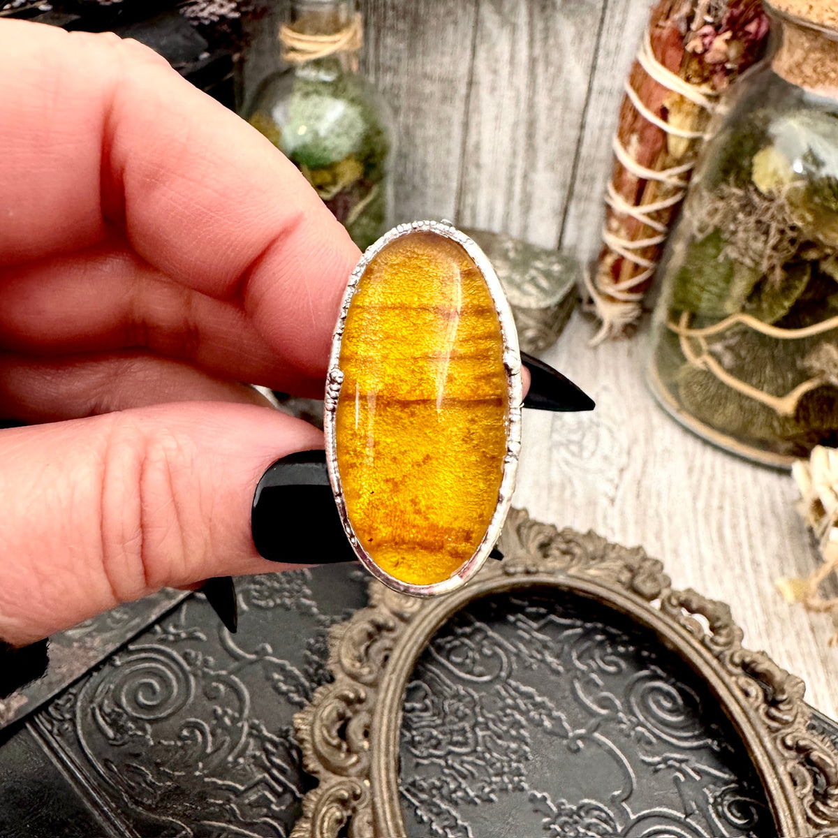 Baltic amber crystal ring by FOXLARK with fine silver setting, size 7.5, showcasing a unique amber gemstone on a silver band.