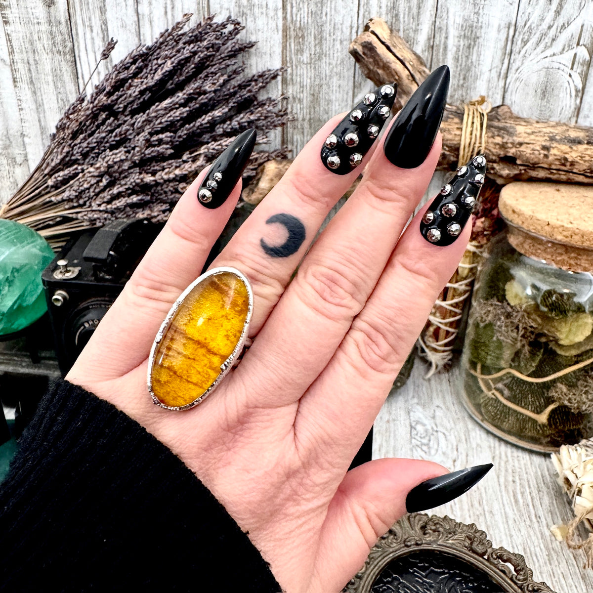 Baltic Amber crystal ring by FOXLARK, fine silver band, size 7.5, one of a kind, detailed close-up of the ring on a neutral background.
