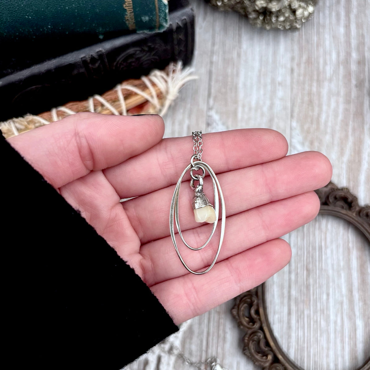 Tiny faux tooth talisman necklace in sterling silver from FOXLARK's Talisman Collection, featuring detailed miniature tooth charm.