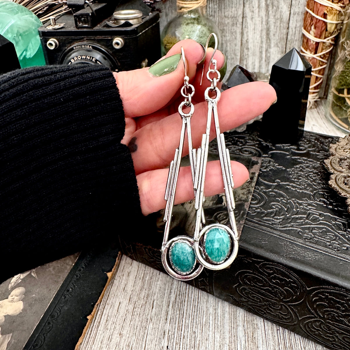 Amazonite silver crystal dangle earrings by FOXLARK featuring long, witchy-style silver earrings with blue-green gemstones and sparkling crystals.