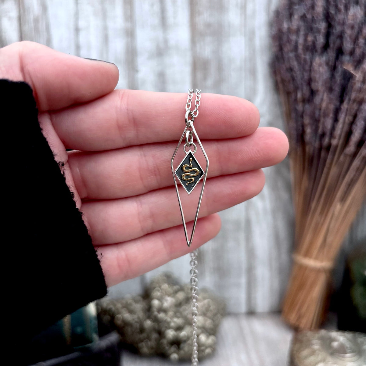 Tiny sterling silver diamond snake talisman necklace from FOXLARK's Talisman Collection, featuring a detailed snake pendant.