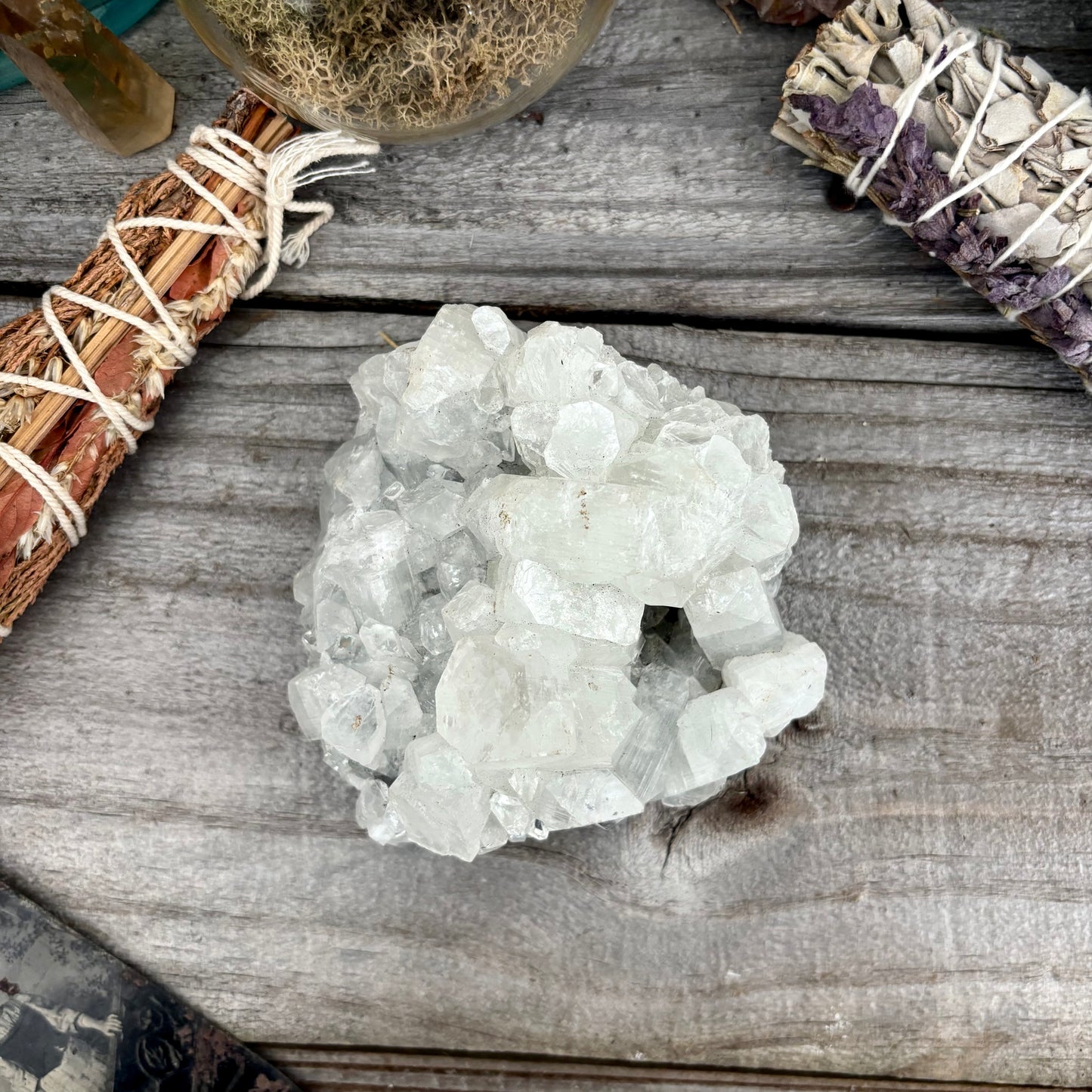 Natural apophyllite crystal cluster with transparent, layered formations from FoxlarkCrystals, displayed on a neutral background.
