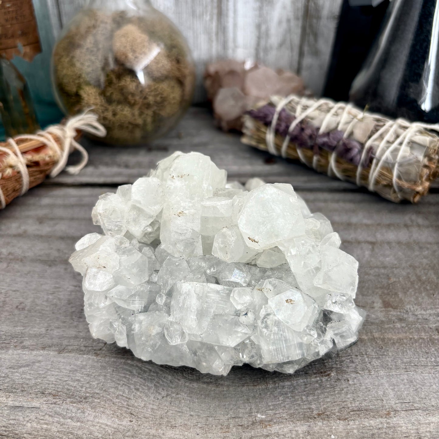 Apophyllite crystal cluster from FoxlarkCrystals showing clear, sparkling mineral formations with a natural crystalline structure.