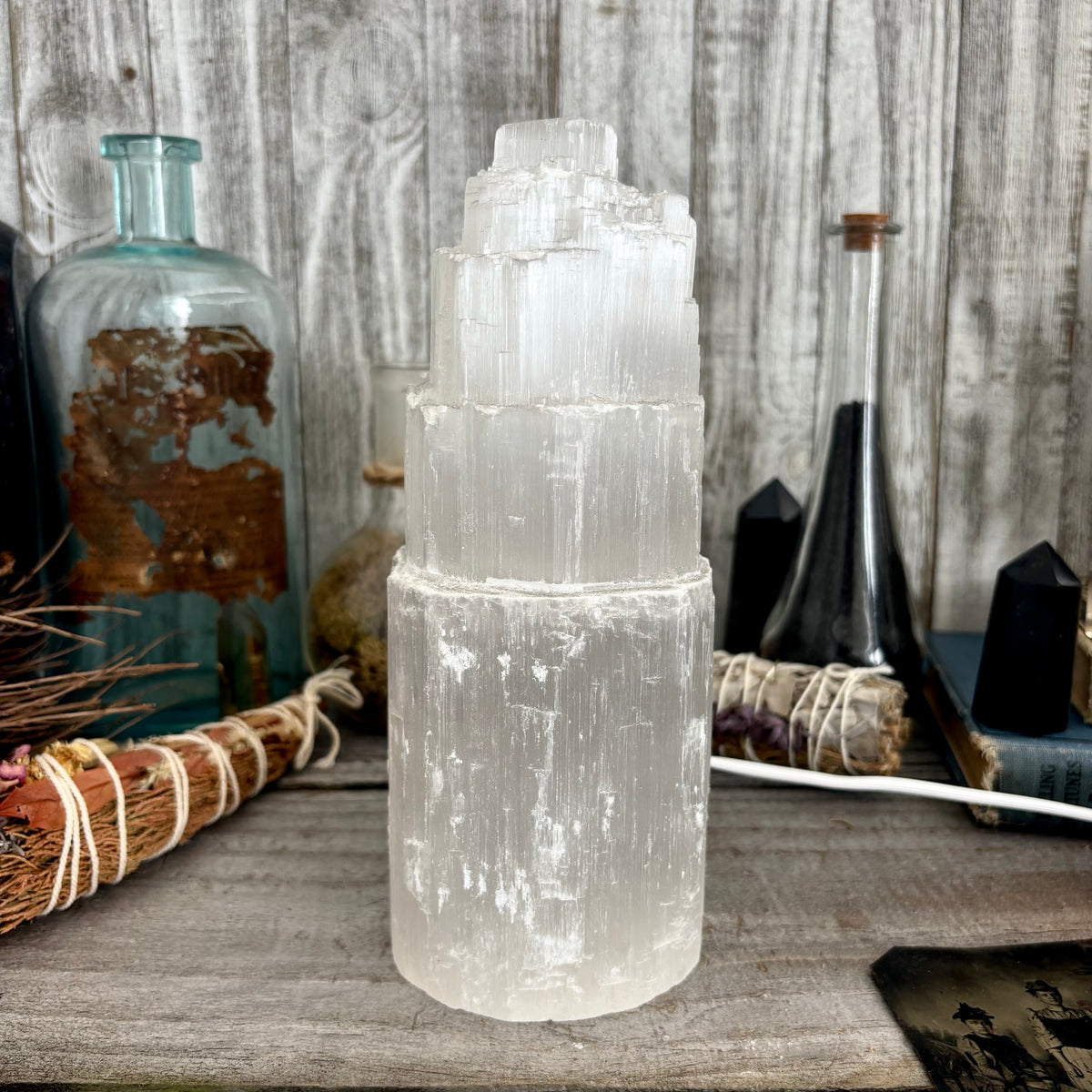 Large self-standing Selenite crystal lamp by FOXLARK, showcasing a smooth, glowing white crystal with natural crystal formations.