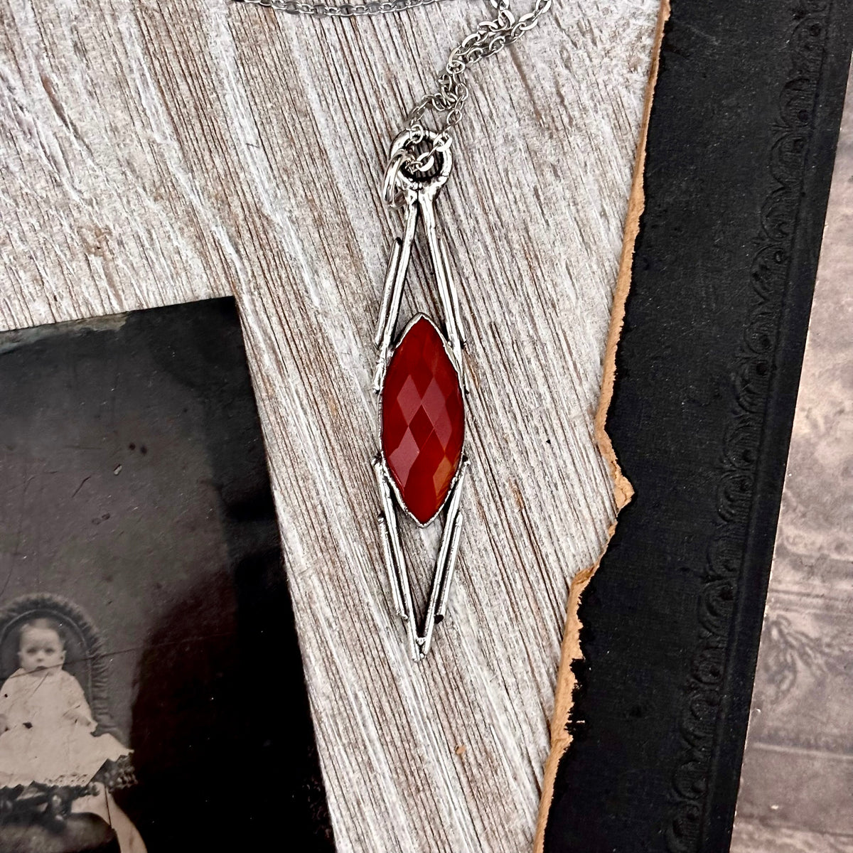 Red Carnelian crystal necklace in fine silver from FOXLARK collection, featuring a one-of-a-kind design with a polished stone pendant.