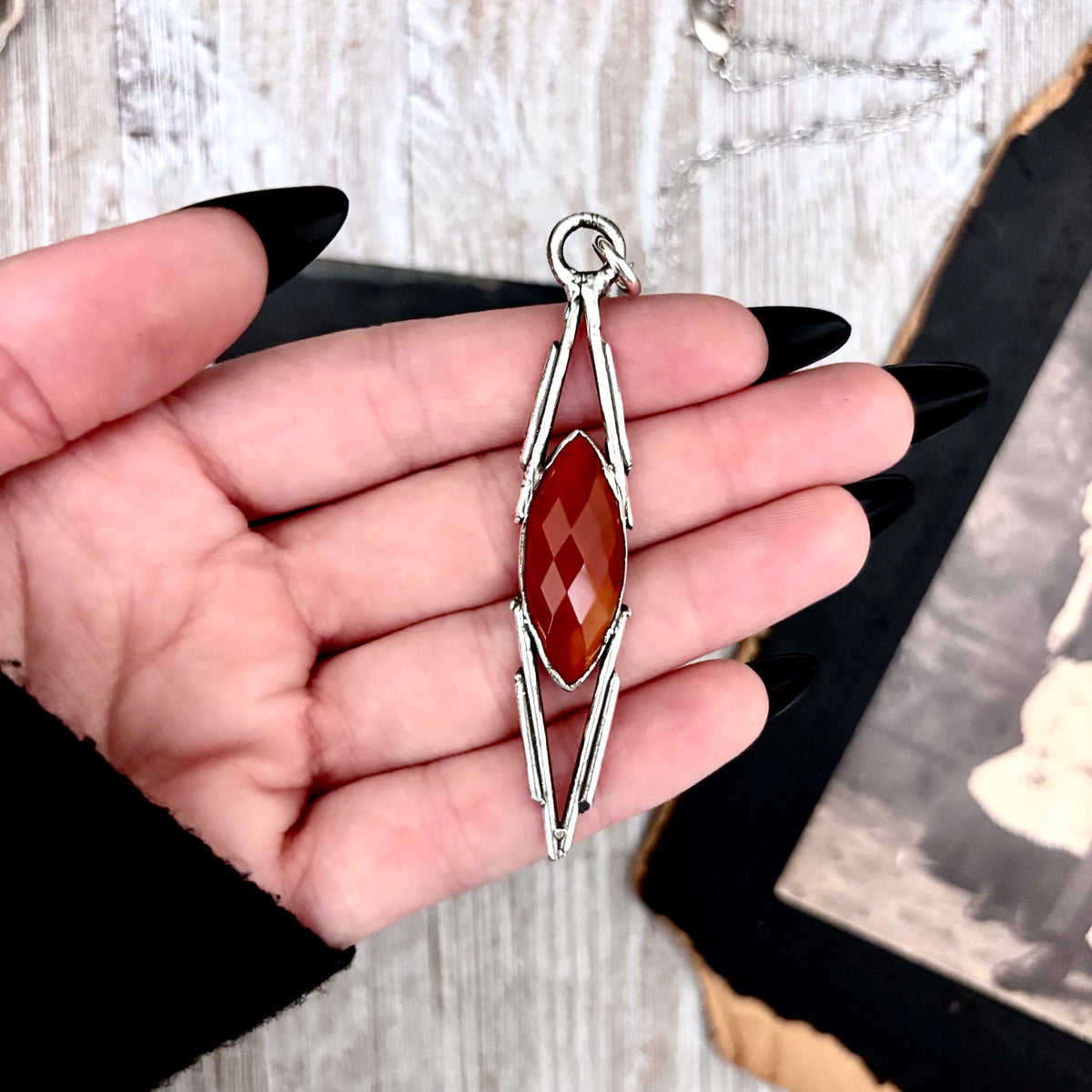 Red Carnelian crystal necklace by FOXLARK featuring a vibrant stone pendant set in fine silver from the Foxlark Collection.