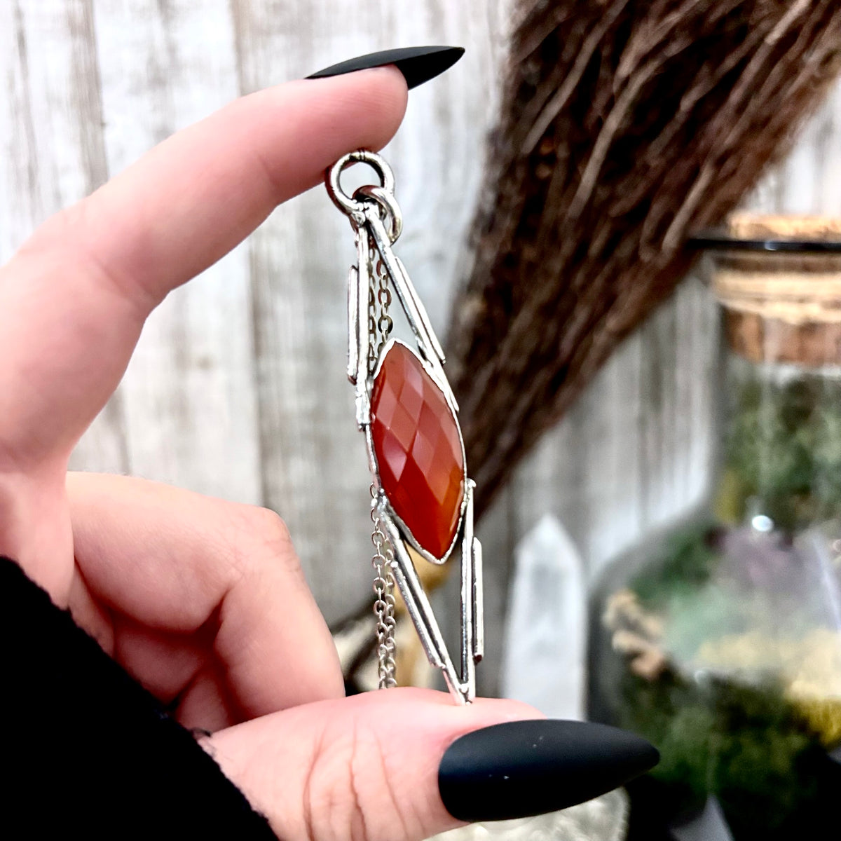 Red Carnelian crystal necklace by FOXLARK with fine silver, showcasing a one-of-a-kind pendant on a delicate chain.