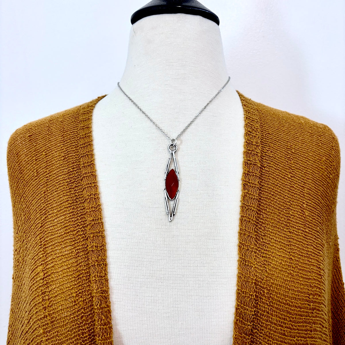 Red Carnelian crystal necklace by FOXLARK with fine silver setting, showcasing a one-of-a-kind design on a delicate chain.
