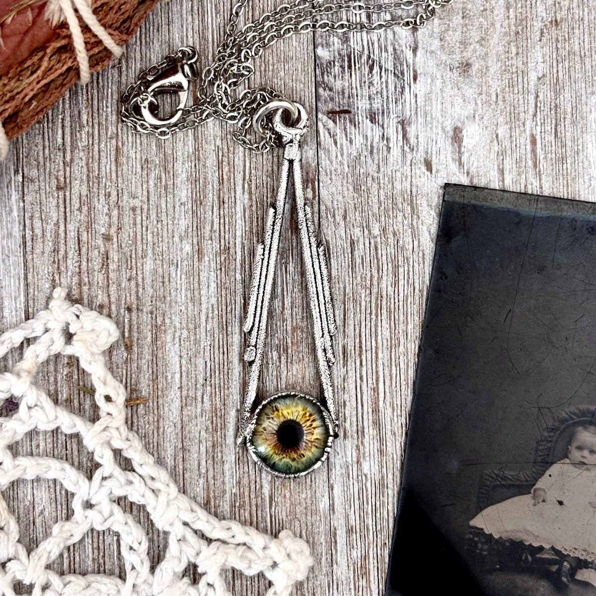 Green eyeball necklace by FOXLARK from the Foxlark Collection, fine silver jewelry featuring a detailed eyeball pendant.