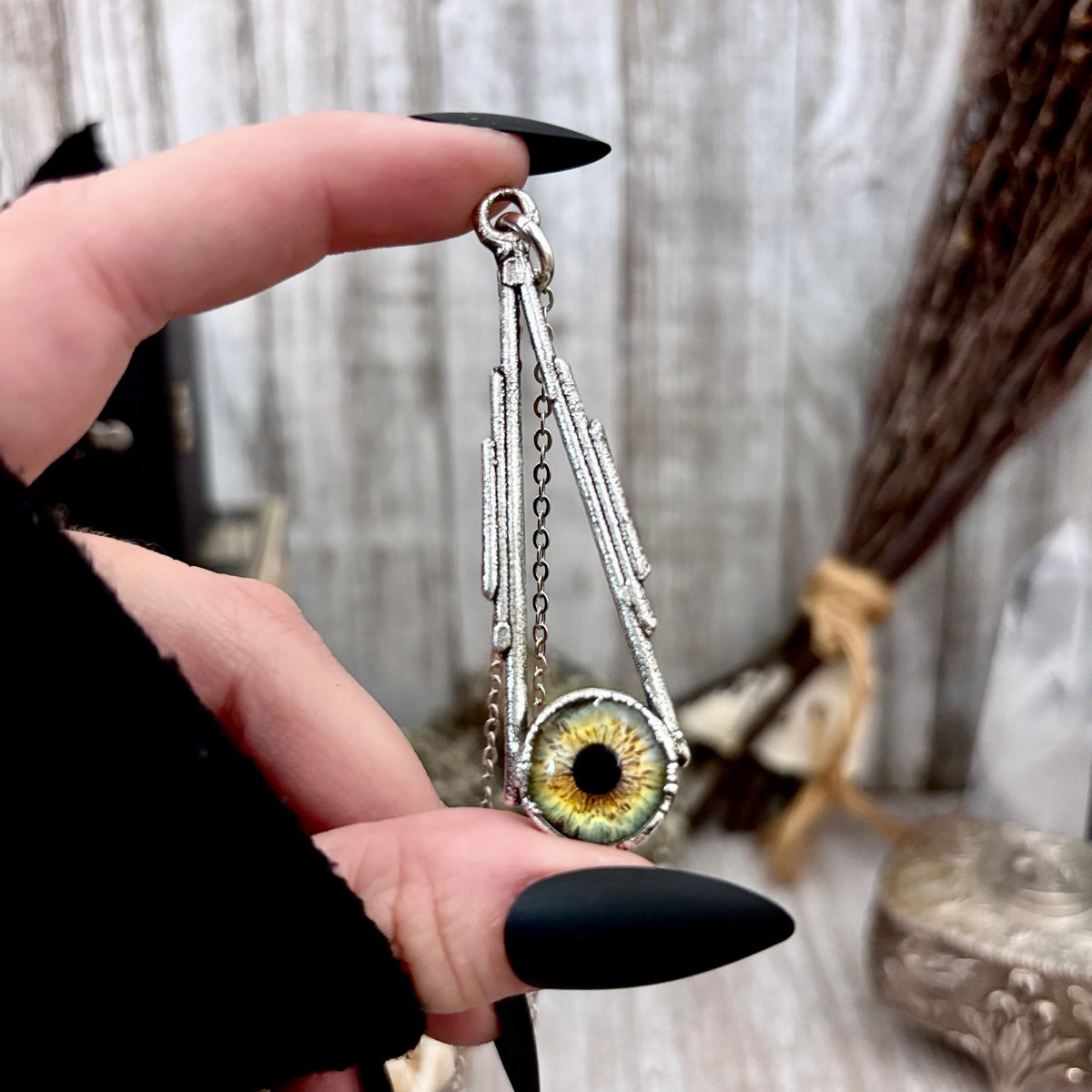 Green eyeball necklace by FOXLARK from the Foxlark Collection, featuring a fine silver eyeball pendant on a chain.
