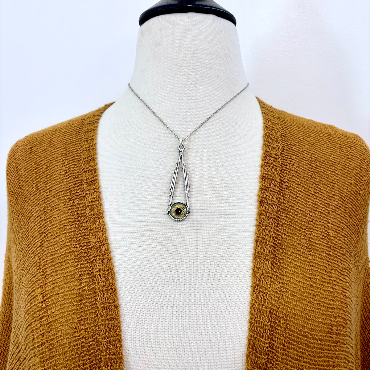 Green eyeball pendant necklace in fine silver from FOXLARK's one-of-a-kind Foxlark Collection, featuring a detailed eyeball design.