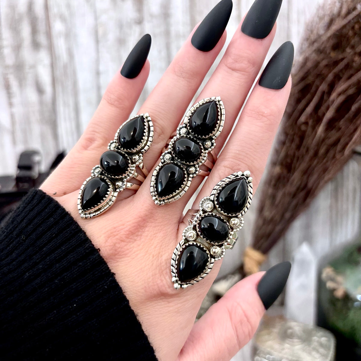 Three stone black onyx ring in sterling silver by FOXLARK, featuring a large crystal accent, available in sizes 6 to 11.