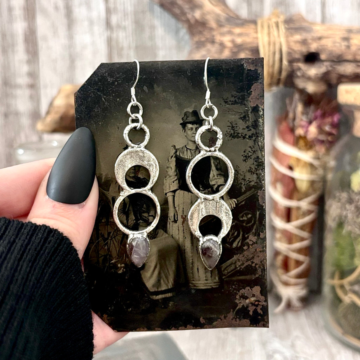 Amethyst crystal silver dangle earrings by FOXLARK featuring long, witchy-style design with intricate silver details and purple stones