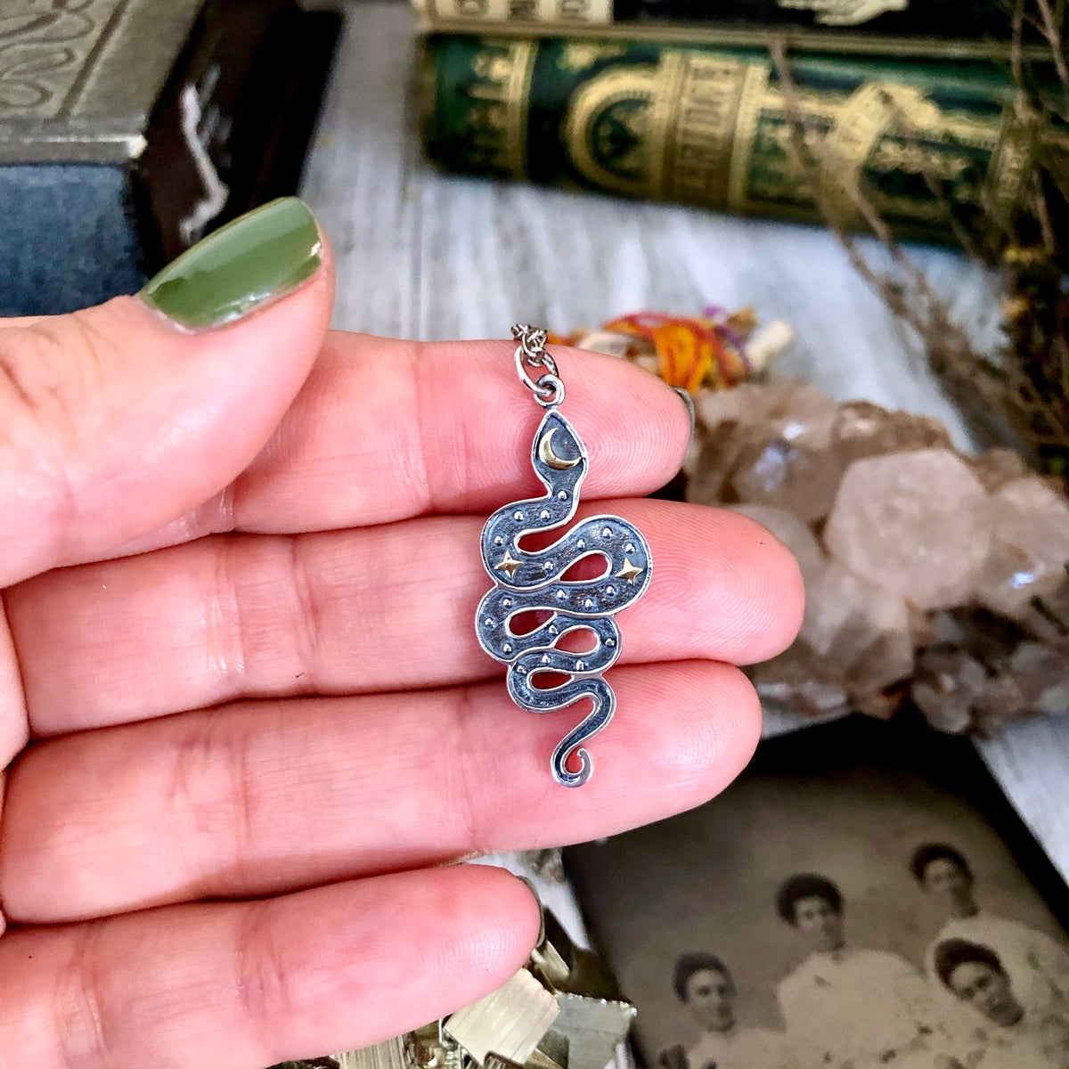 Sterling silver snake pendant with bronze moon and stars from FOXLARK Tiny Talisman Collection, 33x15mm, detailed jewelry design