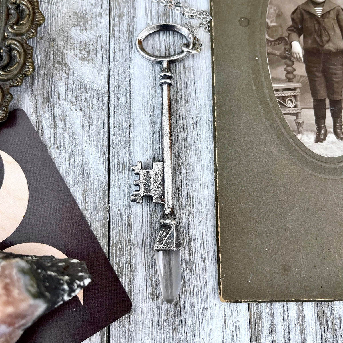 Vintage clear quartz crystal skeleton key pendant necklace by Foxlark in fine silver with intricate detailing.