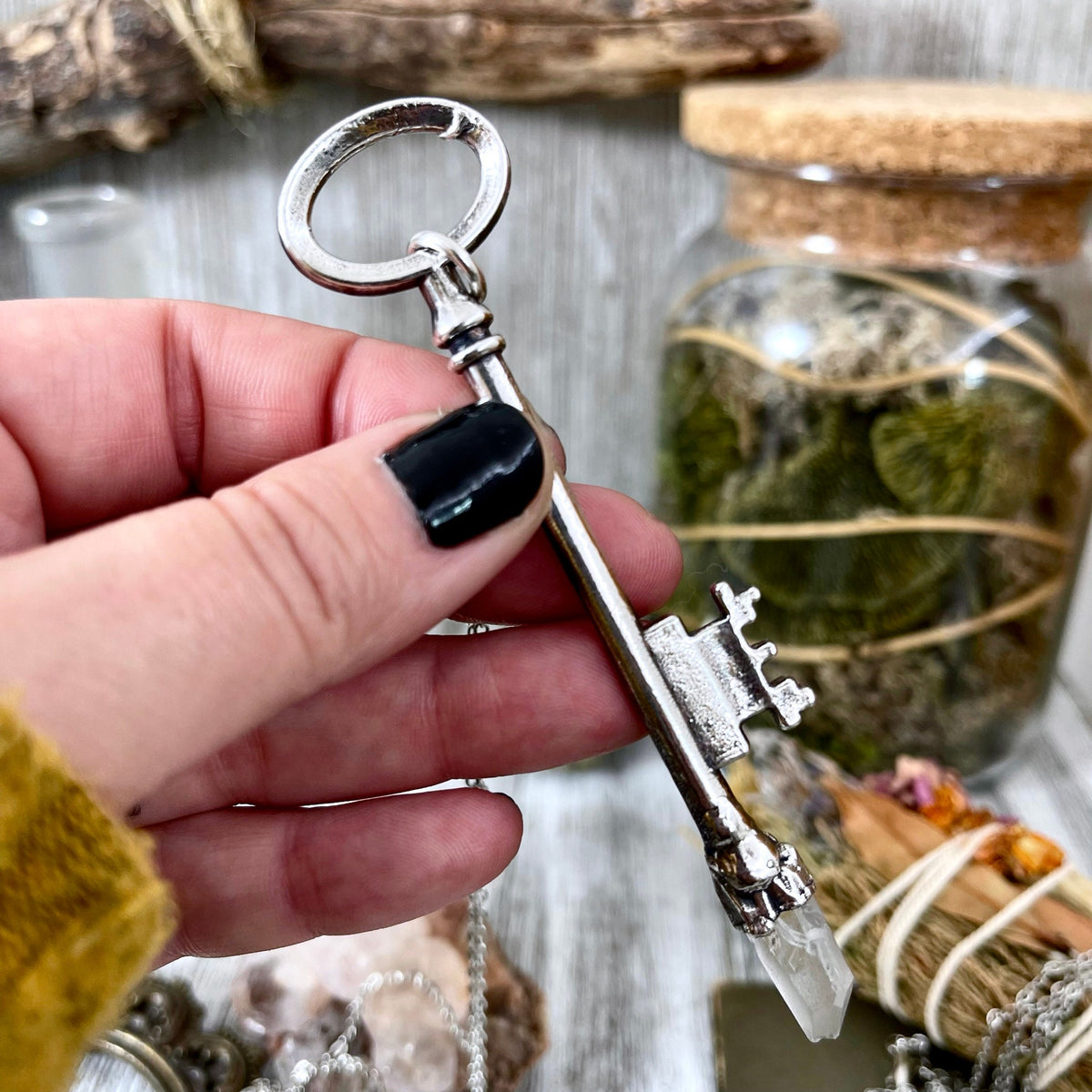 Raw clear quartz crystal pendant with vintage skeleton key in sterling silver, featuring a unique Foxlark Collection necklace.