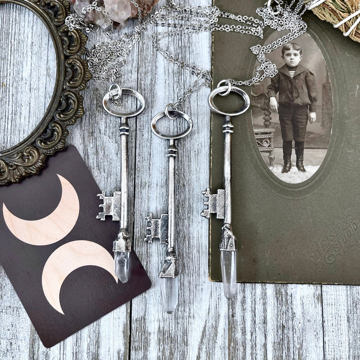 Vintage skeleton key necklace featuring a raw clear quartz crystal pendant in fine silver from the Foxlark Collection.