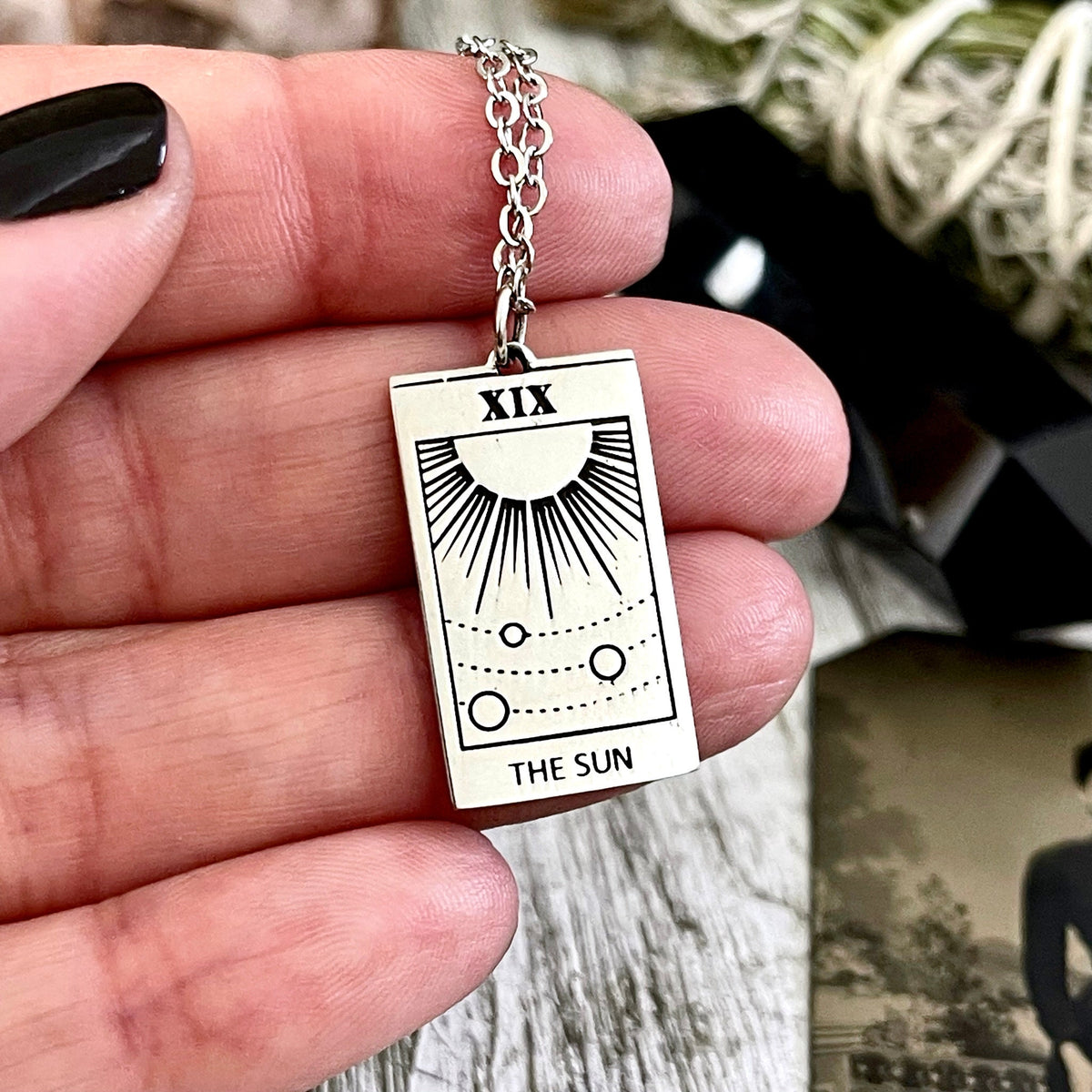 Sterling silver Sun Tarot Card necklace from FOXLARK Tiny Talisman Collection, featuring a 24x14mm detailed sun design.