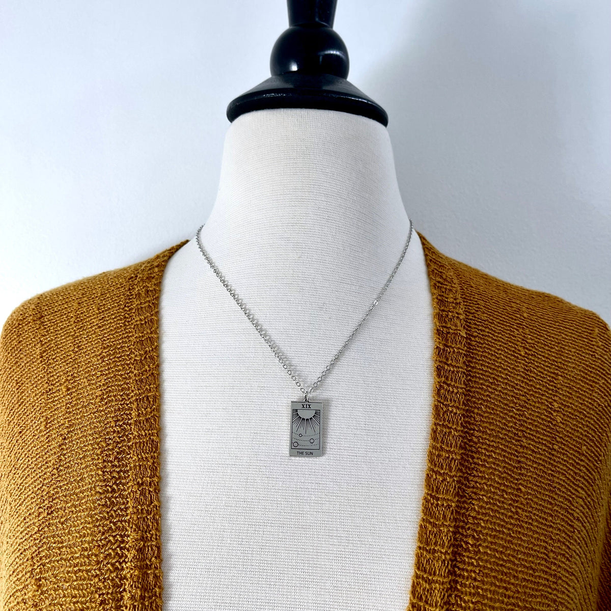 Sterling silver Sun Tarot Card necklace from FOXLARK's Tiny Talisman Collection, featuring a 24x14mm sun design.
