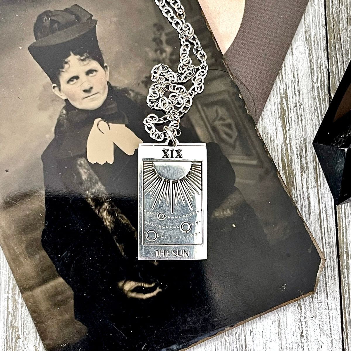 Sterling silver Sun Tarot card pendant from FOXLARK Tiny Talisman Collection, 24x14mm, featuring detailed sun design.