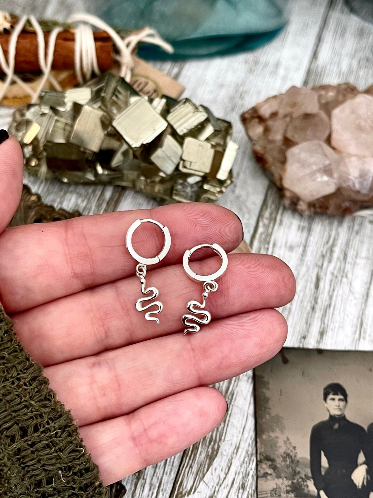 Sterling silver huggie hoop earrings with mini snake designs, 27x11mm, by FOXLARK, featuring detailed snake motifs.