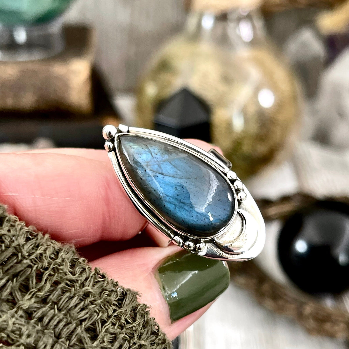 Sterling silver Midnight Moon Labradorite crystal ring by FOXLARK, adjustable to sizes 6-9, with a moon-inspired design.
