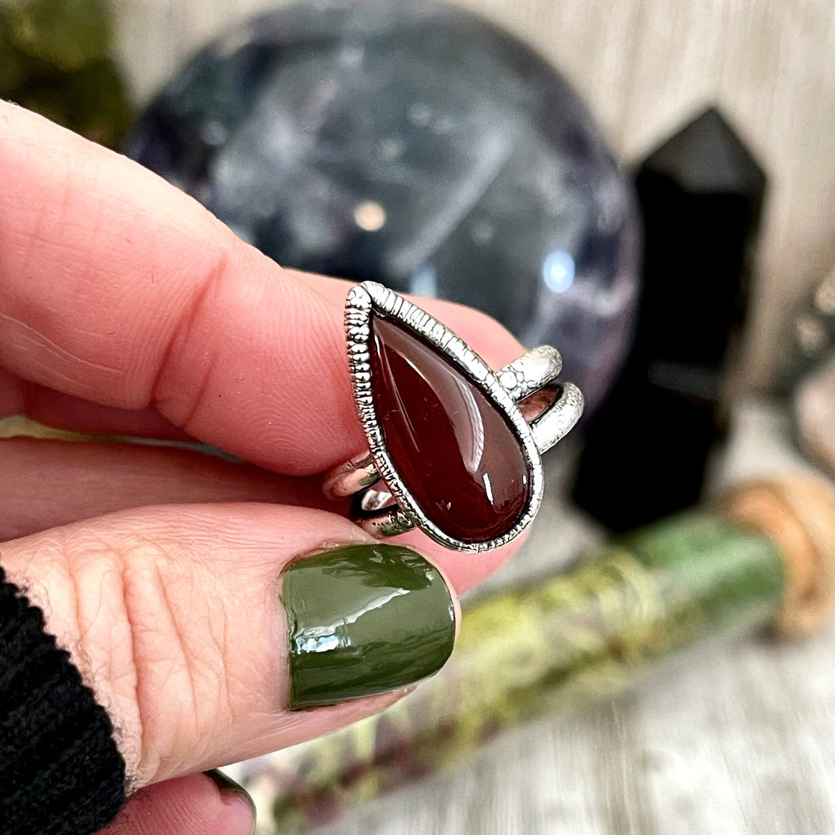Red carnelian teardrop ring by FOXLARK in fine silver, available in sizes 6 to 11, featuring a smooth, polished gemstone setting.