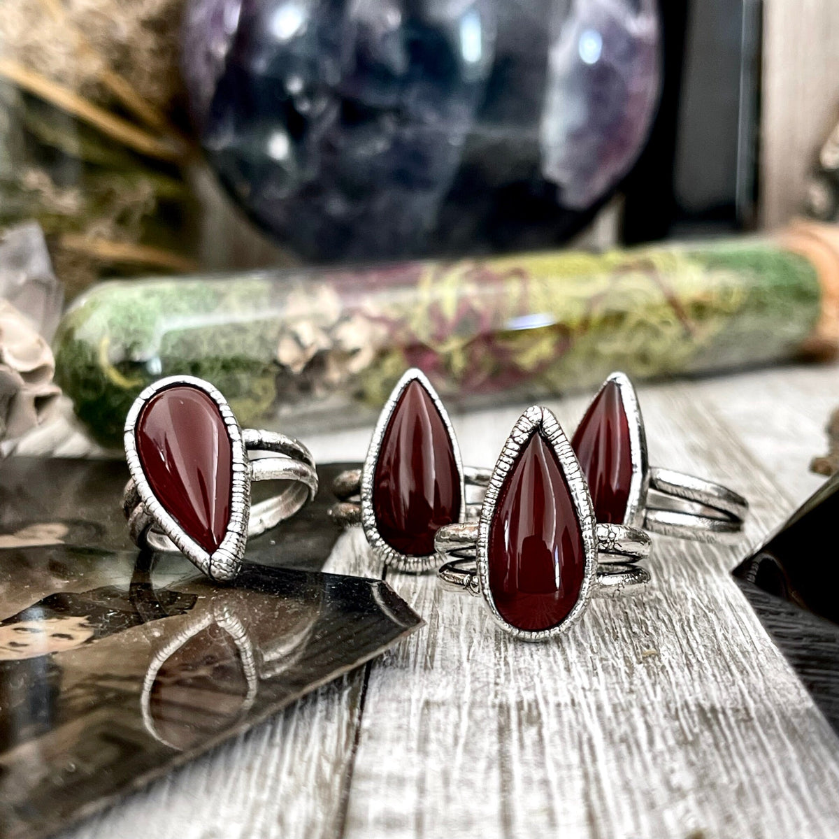 Red Carnelian teardrop ring in fine silver, available in sizes 6-11, from FOXLARK Collection, featuring a polished teardrop gemstone design.