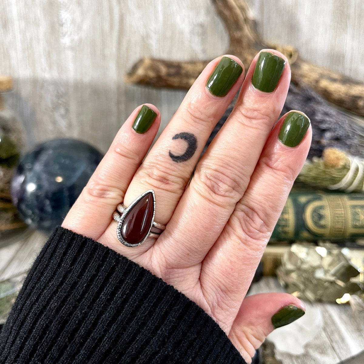 Foxlark Red Carnelian Teardrop Ring in fine silver, available in sizes 6 to 11, featuring a polished teardrop-shaped stone.